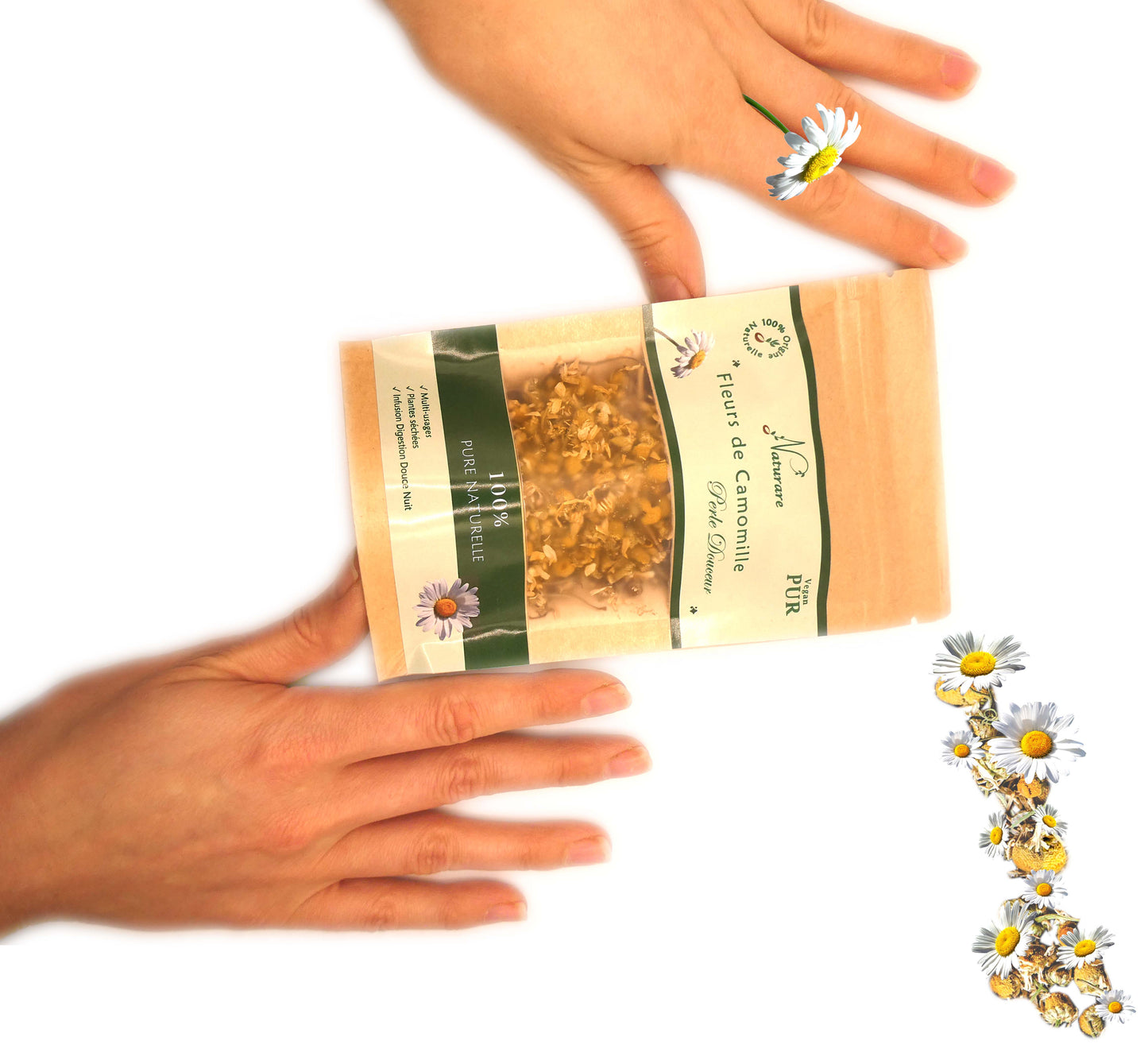 Agnès' Petit Paris Skincare packet of French chamomile tea flowers held between hands on white background