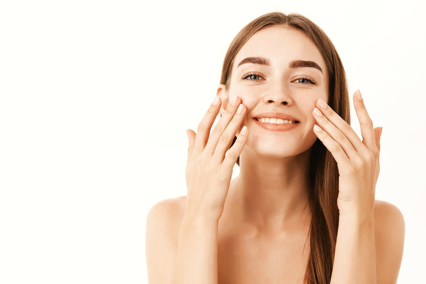 Smiling woman applying organic French facial serum for anti-aging skincare by Agnès' Petit Paris