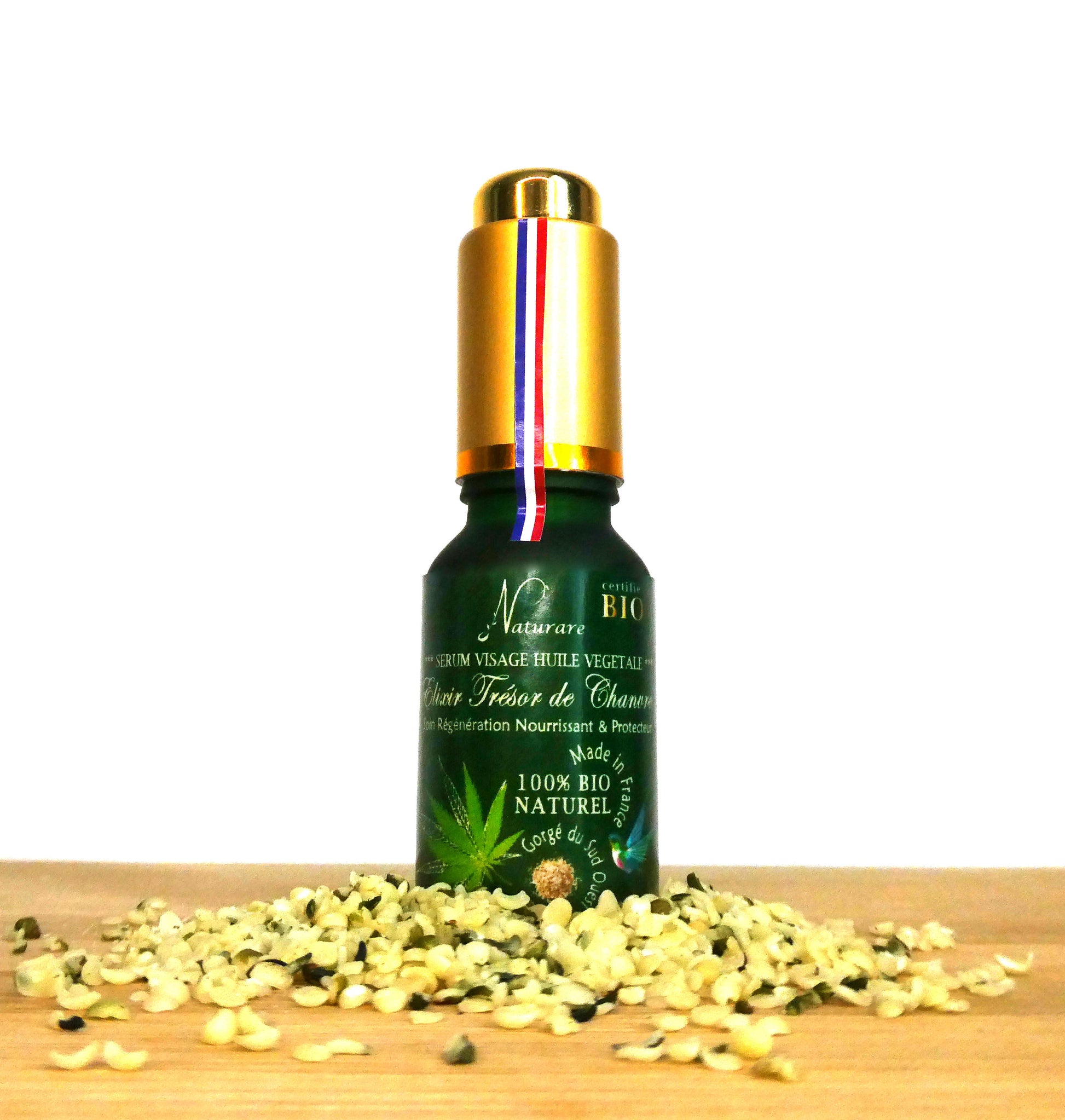 Naturare.fr anti-aging serum bottle labeled French natural skincare elixir surrounded by seeds