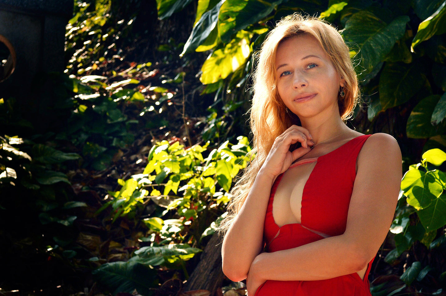 Blonde woman in red dress using Prix PRO natural bust enhancement skincare by Agnes Petit Paris Skincare